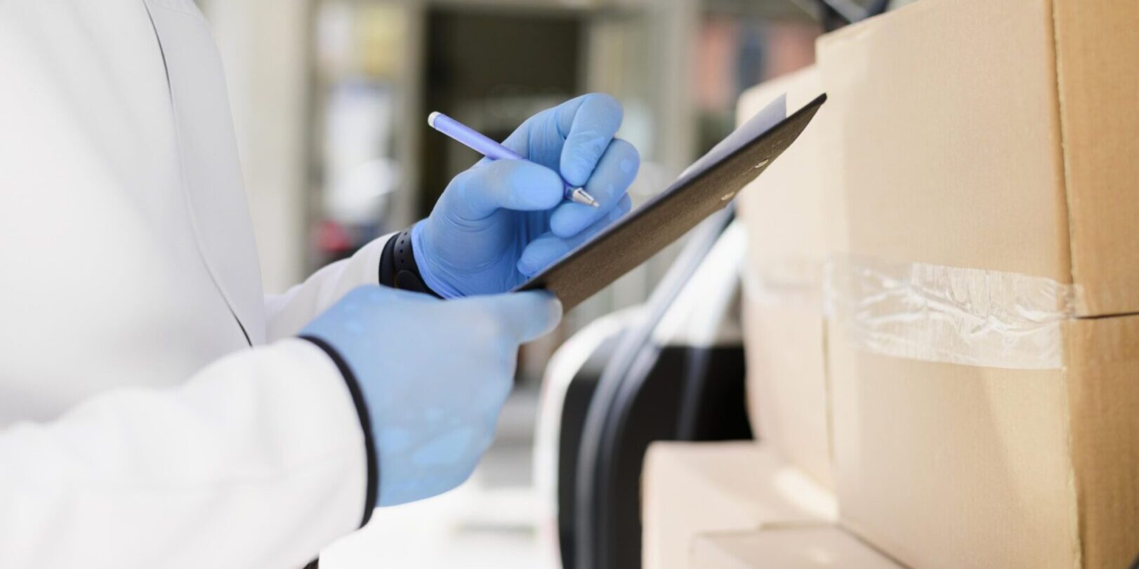 close-up-individual-checking-delivery-list