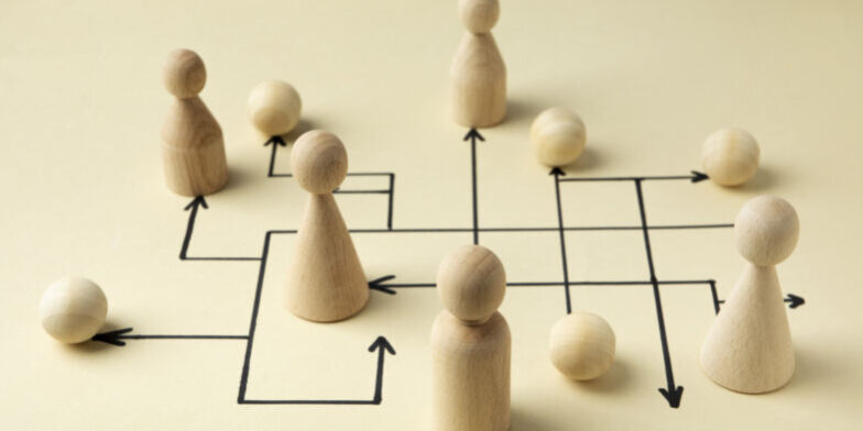 high-angle-wooden-pawns-arrangement